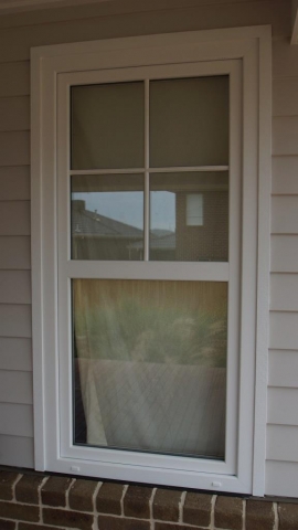 Double hung window with white frame